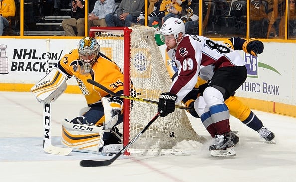 NASHVILLE, TENNESSEE - APRIL 05:  Mikkel Boedker #89 of the Colorado Avalanche tries to wrap the puck around behind goalie Pekka Rinne #35 of the Nashville Predators during the second period at Bridgestone Arena on April 5, 2016 in Nashville, Tennessee.  (Photo by Frederick Breedon/Getty Images)