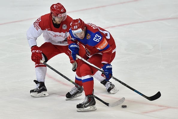 Denmark's forward Lars Eller (L) vies with Russia's forward Yevgeni Dadonov during the group A preliminary round game Russia vs Denmark at the 2016 IIHF Ice Hockey World Championship in Moscow on May 12, 2016. / AFP / YURI KADOBNOV        (Photo credit should read YURI KADOBNOV/AFP/Getty Images)